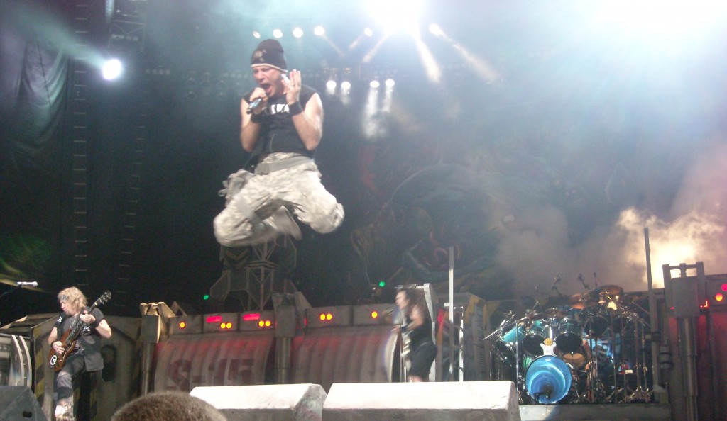 Dickinson leaps from the monitors while performing "The Number Of The Beast."